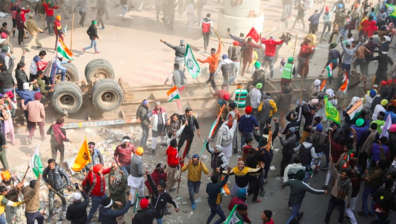 Irate farmers storm Delhi on tractors as tear gas deployed and internet cut off in scramble to defend Indian capital